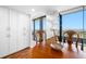 Cozy dining area with hardwood floors, white storage cabinets and views of the city at 7600 Bayshore Dr # 1206, Treasure Island, FL 33706