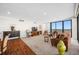Bright living room with sleek flooring, plush seating, and floor-to-ceiling windows at 7600 Bayshore Dr # 1206, Treasure Island, FL 33706