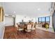 Living room with dining area, hardwood floors and floor to ceiling windows overlooking the city at 7600 Bayshore Dr # 1206, Treasure Island, FL 33706