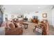 Spacious living room adjacent to dining area with plush seating and scenic views at 7600 Bayshore Dr # 1206, Treasure Island, FL 33706
