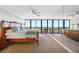 Well lit main bedroom with large windows offering natural light and scenic views at 7600 Bayshore Dr # 1206, Treasure Island, FL 33706