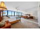 Bright main bedroom boasts scenic views, mirrored wall and elegant furnishings at 7600 Bayshore Dr # 1206, Treasure Island, FL 33706