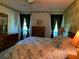 Comfortable bedroom with floral wallpaper, matching furniture, and lots of natural light at 776 Lakewood Dr, Palm Harbor, FL 34684
