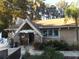 Charming Lake Tarpon Lodge with stone accents, lush landscaping and convenient access to community amenities at 776 Lakewood Dr, Palm Harbor, FL 34684