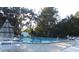 Sparkling community pool surrounded by lounge chairs and well-maintained pool deck, perfect for relaxation and leisure at 776 Lakewood Dr, Palm Harbor, FL 34684
