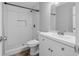 Bathroom with a modern sink, tiled floors, and a stylish tiled shower and niche at 8335 Fountain Ave, Tampa, FL 33615