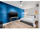 Bedroom with hardwood floors, a full bed, and a sleek design at 8335 Fountain Ave, Tampa, FL 33615