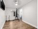Bonus room offers a sleek ceiling fan, wood floors, and heavy bag at 8335 Fountain Ave, Tampa, FL 33615