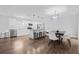 Modern kitchen with stainless steel appliances, white cabinetry, eat-in island, and adjacent dining area at 8335 Fountain Ave, Tampa, FL 33615