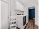 A well-equipped laundry room boasts storage cabinets above a modern washer and dryer at 8335 Fountain Ave, Tampa, FL 33615