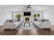 Bright living room with high ceilings, fireplace, and modern furnishings, creating a cozy and inviting atmosphere at 8335 Fountain Ave, Tampa, FL 33615