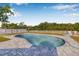 Refreshing backyard pool surrounded by brick pavers, perfect for relaxing and entertaining at 8335 Fountain Ave, Tampa, FL 33615