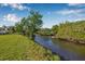 Scenic water view with lush landscaping, offering a tranquil and private setting at 8335 Fountain Ave, Tampa, FL 33615
