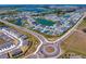 Bird's eye view of a well-planned community with homes surrounding tranquil lakes and roads at 8346 Ivy Stark Boulevard, Wesley Chapel, FL 33545