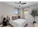 Inviting bedroom featuring neutral tones, natural light, and stylish furnishings at 8346 Ivy Stark Boulevard, Wesley Chapel, FL 33545