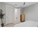Relaxing bedroom features neutral tones, ample closet space, and modern design elements for comfort and style at 8346 Ivy Stark Boulevard, Wesley Chapel, FL 33545