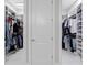 Dual walk-in closets with custom shelving and ample hanging space for organized storage and easy access at 8346 Ivy Stark Boulevard, Wesley Chapel, FL 33545