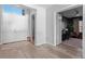 Foyer view with tile flooring, a decorative doorway, and a view into the office at 8346 Ivy Stark Boulevard, Wesley Chapel, FL 33545