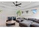 Large living room featuring an oversized sectional, recessed lighting and drink bar for leisure and entertainment at 8346 Ivy Stark Boulevard, Wesley Chapel, FL 33545