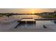 Inviting pool and spa with lake view at sunset at 8346 Ivy Stark Boulevard, Wesley Chapel, FL 33545