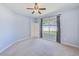 Spacious bedroom featuring carpet flooring, natural light and ceiling fan at 8521 Acorn Ridge Ct, Tampa, FL 33625