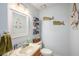 Cozy bathroom with nautical decorations, a single vanity, and a relaxing ambiance at 8704 Tarrington Pl, Tampa, FL 33635