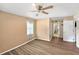 Neutral bedroom featuring modern flooring and ensuite bathroom with ample closet space at 8704 Tarrington Pl, Tampa, FL 33635