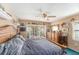 Cozy bedroom with sliding glass door, decorated with various ornaments at 8704 Tarrington Pl, Tampa, FL 33635