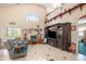 Spacious living room featuring high ceilings, tile flooring, ample natural light, and a comfortable seating area at 8704 Tarrington Pl, Tampa, FL 33635