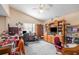 Spacious home office featuring multiple desks, storage, and natural light for productivity at 8704 Tarrington Pl, Tampa, FL 33635