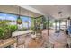 Relaxing covered patio with tile flooring and a view of the backyard at 8704 Tarrington Pl, Tampa, FL 33635