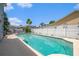 Inviting backyard pool with an adjacent pergola offering a tranquil spot for outdoor enjoyment at 8704 Tarrington Pl, Tampa, FL 33635