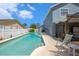 Private backyard pool with a screened lanai perfect for relaxing and entertaining outdoors at 8704 Tarrington Pl, Tampa, FL 33635