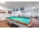 Recreation room with billiard tables and accent wall art at 9 Forbes Pl # 205, Dunedin, FL 34698