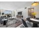 Comfortable living and dining area with sliding glass doors at 9 Forbes Pl # 205, Dunedin, FL 34698