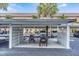 Designated parking area with carport features convenient bike storage and ample parking spaces at 9 Forbes Pl # 205, Dunedin, FL 34698