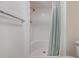 Shower with shower curtain and updated shower head at 9 Forbes Pl # 205, Dunedin, FL 34698