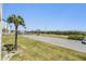 Scenic view from the property showcasing a well-maintained landscape and proximity to the beach at 9 Forbes Pl # 205, Dunedin, FL 34698