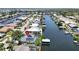 This house features solar panels, a waterfront location with a boat dock, and close proximity to a canal at 907 Golf Island Dr, Apollo Beach, FL 33572