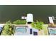 Aerial view showcasing the property's private boat dock, solar panels, screened pool, and access to the open water at 907 Golf Island Dr, Apollo Beach, FL 33572