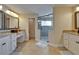 Updated bathroom features dual sinks, granite countertops, and glass shower at 907 Golf Island Dr, Apollo Beach, FL 33572