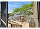 Waterfront deck with outdoor seating offers a picturesque view of the tranquil canal and the surrounding area at 907 Golf Island Dr, Apollo Beach, FL 33572