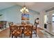 Dining room with large table, decor and access to the bedrooms and french doors to the outside at 907 Golf Island Dr, Apollo Beach, FL 33572