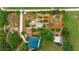 Aerial view of a community garden showcasing multiple plots and lush greenery in a well-maintained outdoor space at 907 Golf Island Dr, Apollo Beach, FL 33572