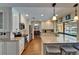 Modern kitchen with white cabinets, granite countertops, stainless steel appliances, and breakfast bar at 907 Golf Island Dr, Apollo Beach, FL 33572