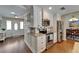 Kitchen featuring white cabinets, stainless appliances, granite countertops, and an eat-in area at 907 Golf Island Dr, Apollo Beach, FL 33572