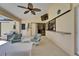 Relaxing lanai with comfortable seating, outdoor grill, and a tropical vibe, perfect for entertaining at 907 Golf Island Dr, Apollo Beach, FL 33572