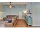 Comfortable living room boasts hardwood floors, modern console, and updated furnishings at 907 Golf Island Dr, Apollo Beach, FL 33572
