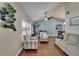 Living room featuring hardwood floors, comfortable furniture, and a dining area in the background at 907 Golf Island Dr, Apollo Beach, FL 33572