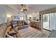 Open concept living area with a modern kitchen, comfortable seating, and hardwood floors at 907 Golf Island Dr, Apollo Beach, FL 33572
